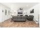 Cozy living room features a stone accent wall, fireplace, and a comfortable leather sectional at 13 W Silverwood Dr, Phoenix, AZ 85045