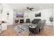 Inviting living room boasts a fireplace, a stylish ceiling fan, and comfortable seating arrangement at 13 W Silverwood Dr, Phoenix, AZ 85045