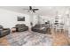 Open floor plan shows a living room area with views into the kitchen and dining area at 13 W Silverwood Dr, Phoenix, AZ 85045