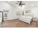 Bright main bedroom features plush carpet, shuttered windows, ceiling fan, and access to an outdoor deck at 13 W Silverwood Dr, Phoenix, AZ 85045
