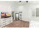 Spacious main bedroom features a TV, dresser, walk-in closet, and access to a private patio at 13 W Silverwood Dr, Phoenix, AZ 85045