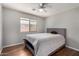 Comfortable bedroom with laminate floors, ample natural light, and neutral tones at 13373 W Boca Raton Rd, Surprise, AZ 85379