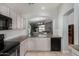 Bright kitchen features stainless steel appliances, granite countertops, and an open layout at 13373 W Boca Raton Rd, Surprise, AZ 85379