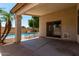 Covered patio area provides respite from the sun with great views of the pool at 13373 W Boca Raton Rd, Surprise, AZ 85379