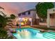 A dazzling pool with a poolside cabana, mature trees, and outdoor storage area at 13636 W Calavar Rd, Surprise, AZ 85379