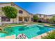Beautiful backyard featuring a sparkling pool and well-maintained landscaping creating a private retreat at 13636 W Calavar Rd, Surprise, AZ 85379
