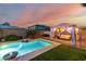 Relaxing backyard with sparkling pool, privacy wall, and gazebo-covered lounge area at 13636 W Calavar Rd, Surprise, AZ 85379