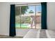 Bright bedroom with pool view at 13636 W Calavar Rd, Surprise, AZ 85379
