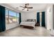 Bright bedroom with large windows and an outside view at 13636 W Calavar Rd, Surprise, AZ 85379