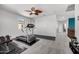 Carpeted exercise room with ceiling fan and an abundance of natural light at 13636 W Calavar Rd, Surprise, AZ 85379