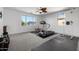 Upstairs exercise room with ceiling fan and an abundance of natural light at 13636 W Calavar Rd, Surprise, AZ 85379