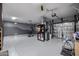 Garage with epoxy flooring and storage at 13636 W Calavar Rd, Surprise, AZ 85379