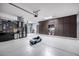 Spacious garage with ample storage cabinets and epoxy floor perfect for car enthusiasts or hobbyists at 13636 W Calavar Rd, Surprise, AZ 85379
