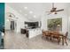 Open-concept kitchen featuring a large island, dining area, and seamless flow into living spaces at 13636 W Calavar Rd, Surprise, AZ 85379