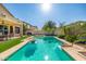 Sparkling pool featuring easy entry steps and well-manicured artificial turf for easy maintenance at 13636 W Calavar Rd, Surprise, AZ 85379