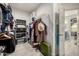 Spacious walk-in closet with built-in shelving and hanging racks, providing ample storage space at 13636 W Calavar Rd, Surprise, AZ 85379
