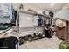 Well-organized walk-in closet with shelves, hanging rods, and shoe racks for efficient storage at 13636 W Calavar Rd, Surprise, AZ 85379