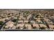 A serene neighborhood featuring homes with backyard pools, lush trees, desert landscaping, and well-maintained streets at 14609 S 24Th Way, Phoenix, AZ 85048