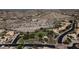 Community aerial showcasing mature landscaping, desert surroundings, and a picturesque common green area at 14609 S 24Th Way, Phoenix, AZ 85048