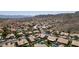 Expansive aerial shot of a vibrant desert community, showcasing homes with pools amid a scenic mountain backdrop at 14609 S 24Th Way, Phoenix, AZ 85048
