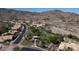 Scenic aerial view of the desert community featuring lush landscaping, a community park, and mountain views at 14609 S 24Th Way, Phoenix, AZ 85048