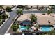An aerial view of the home shows a backyard pool and spa, covered patio, and desert landscaping at 14609 S 24Th Way, Phoenix, AZ 85048