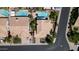 An aerial view shows backyard pools, nice landscaping, and tile roofs in a residential neighborhood at 14609 S 24Th Way, Phoenix, AZ 85048