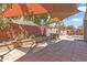 Relaxing backyard featuring stylish patio under shade sails and a built-in barbecue grill, perfect for outdoor entertaining at 14609 S 24Th Way, Phoenix, AZ 85048