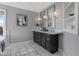 Bathroom with double sinks, granite countertops, and marble tile flooring at 14609 S 24Th Way, Phoenix, AZ 85048