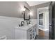 Bright bathroom features double sinks, marble countertops, and black fixtures at 14609 S 24Th Way, Phoenix, AZ 85048