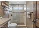 Detailed bathroom featuring glass-enclosed shower, stone accents, and updated fixtures at 14609 S 24Th Way, Phoenix, AZ 85048