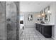 Bright bathroom featuring a glass shower, free-standing tub, marble tile flooring, and double vanity at 14609 S 24Th Way, Phoenix, AZ 85048