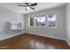 Bedroom with hardwood floors, ceiling fan, built-in desk, and great natural light at 14609 S 24Th Way, Phoenix, AZ 85048