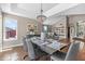 Well-lit dining room with stylish decor, large windows, and seamless flow to the living area at 14609 S 24Th Way, Phoenix, AZ 85048