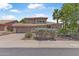 Charming two-story home with a well-manicured lawn, desert landscaping and attached garage at 14609 S 24Th Way, Phoenix, AZ 85048