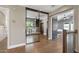 Upstairs hallway featuring wood floors, and a large mirror wall offering views into another room at 14609 S 24Th Way, Phoenix, AZ 85048