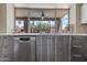 Modern kitchen with stainless steel appliances, sleek cabinetry, and a large window overlooking the backyard at 14609 S 24Th Way, Phoenix, AZ 85048