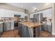 Well-equipped kitchen featuring stainless steel appliances, modern cabinetry, and a butcher block island at 14609 S 24Th Way, Phoenix, AZ 85048