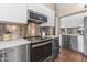 Updated kitchen with stainless steel appliances, modern cabinetry, and stylish backsplash at 14609 S 24Th Way, Phoenix, AZ 85048