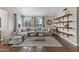 Bright and airy living room with plush seating, decorative shelves, and plenty of natural light at 14609 S 24Th Way, Phoenix, AZ 85048