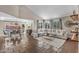 Spacious living room with a vaulted ceiling, comfortable sofa, dining area, and large windows at 14609 S 24Th Way, Phoenix, AZ 85048