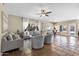 Open-concept living room with tile flooring, stylish furniture, and large windows that provide natural light and outdoor views at 14609 S 24Th Way, Phoenix, AZ 85048