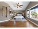 Main bedroom with hardwood floors, ceiling fan, and beautiful windows at 14609 S 24Th Way, Phoenix, AZ 85048