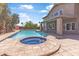 Spacious backyard features a sparkling pool, hot tub, and covered patio for relaxation and entertainment at 14609 S 24Th Way, Phoenix, AZ 85048