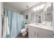 Clean and bright bathroom with a single sink vanity and a shower-tub combination at 14770 W Columbine Dr, Surprise, AZ 85379