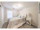 Cozy bedroom with plush carpeting, a comfortable queen-sized bed, and soft natural lighting at 14770 W Columbine Dr, Surprise, AZ 85379