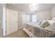 Charming bedroom featuring a cozy queen-sized bed, plush carpet, and ample closet space at 14770 W Columbine Dr, Surprise, AZ 85379