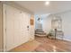 Bright foyer with hardwood floors, a staircase, and a stylish table with decor at 14770 W Columbine Dr, Surprise, AZ 85379
