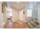 Bright foyer with hardwood floors and stairs leading up to the second level at 14770 W Columbine Dr, Surprise, AZ 85379