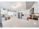 Well-lit kitchen with white cabinets, stainless steel appliances, and a spacious countertop at 14770 W Columbine Dr, Surprise, AZ 85379
